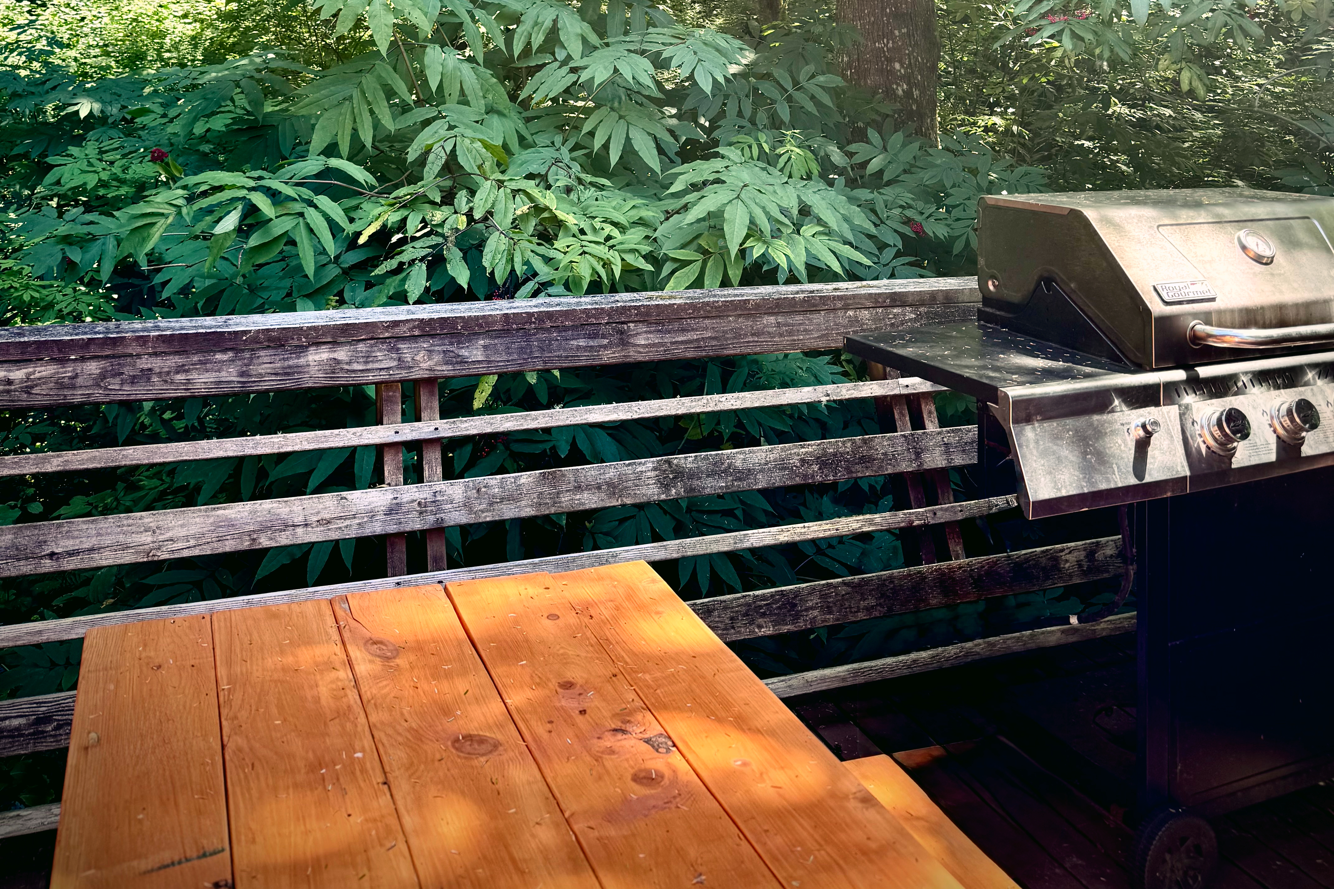 Outdoor deck and dining space at Chez Nous Chalet
